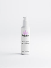 White face cream bottle labeled 'Premia Dark Spot Face Cream' on a white background